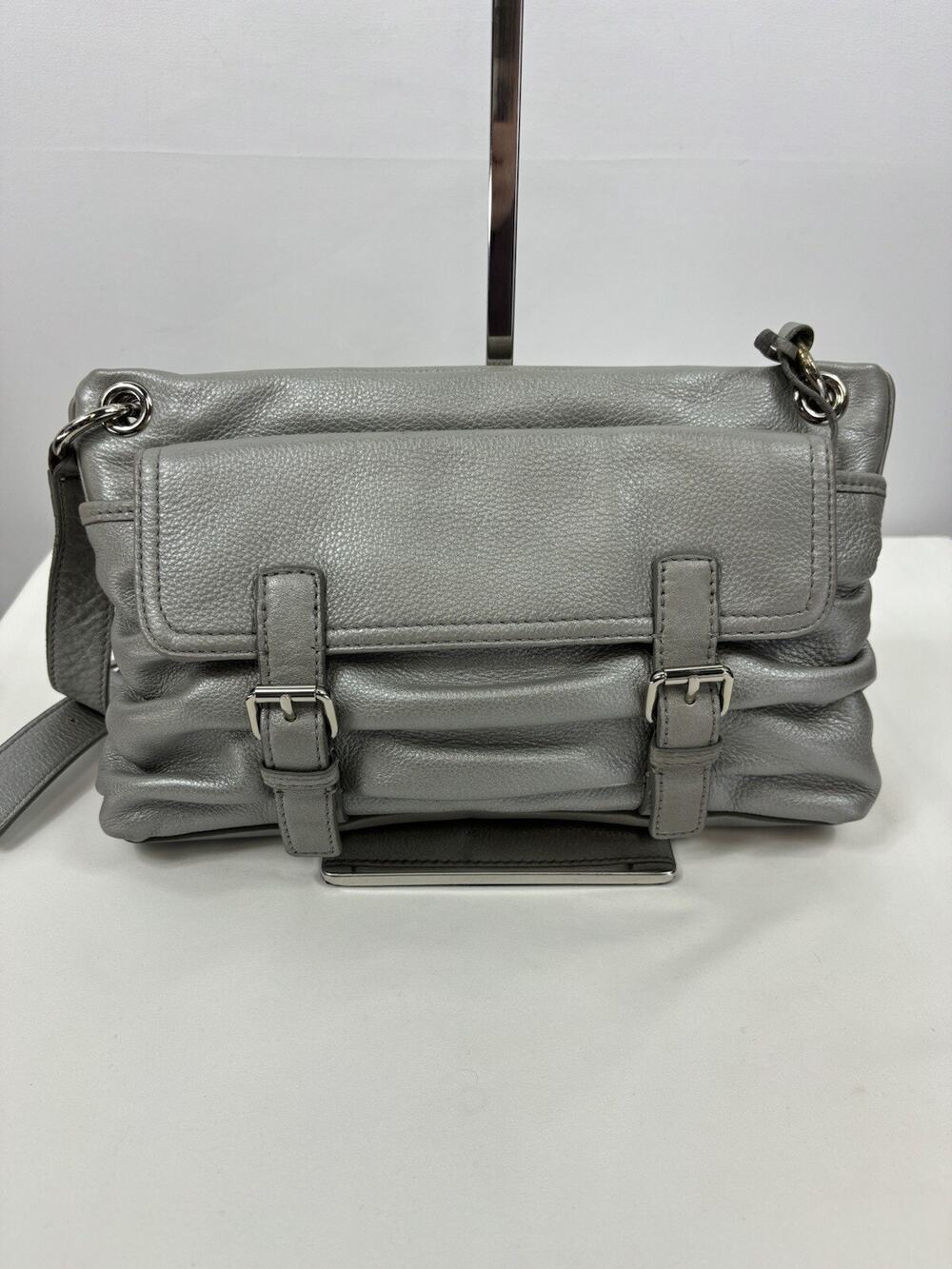Cole Haan Crossbody Bag Silver Leather Buckles Outside Pocket Zipper Closure